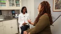 A doctor speaking to a patient about treatment.